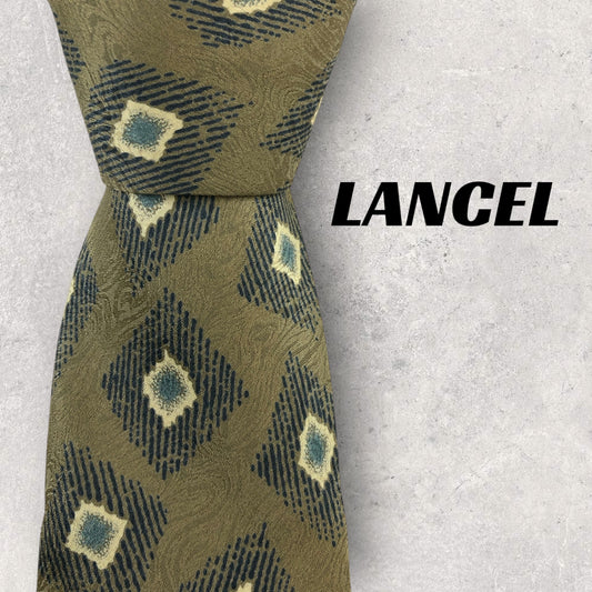 [6710] Good quality! Lancel tie, gold color 